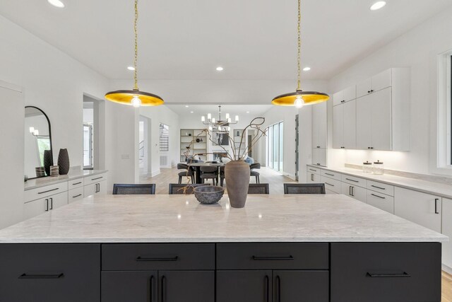 6004 Jocelyn Hollow Rd, Nashville, TN 37205 - kitchen featuring a large island, white cabinetry, and recessed lighting