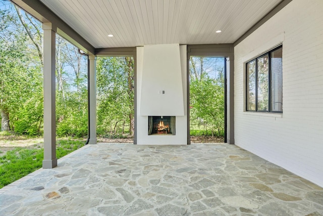 6004 Jocelyn Hollow Rd, Nashville, TN 37205 - view of patio / terrace featuring a warm lit fireplace