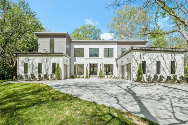 6004 Jocelyn Hollow Rd, Nashville, TN 37205 - rear view of property featuring a yard, concrete driveway, and stucco siding