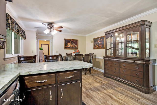 3115 Coon Hunter Lodge Rd, Jamestown, TN 38556 - kitchen with dark brown cabinetry, ornamental molding, a ceiling fan, light countertops, and light wood-type flooring