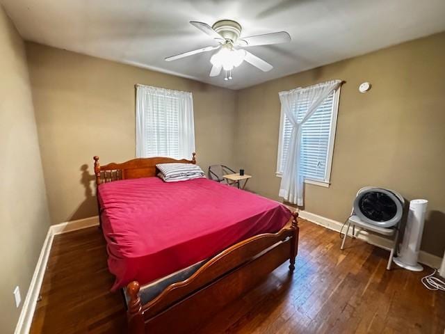 bedroom featuring baseboards, ceiling fan, and wood finished floors