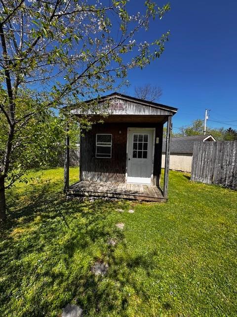 view of shed with fence