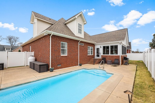 view of pool with a patio area, a fenced backyard, entry steps, and a fenced in pool
