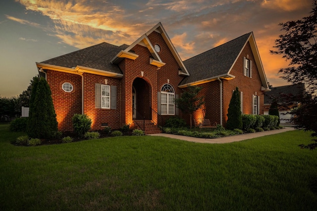 3307 Genoa Dr, Murfreesboro, TN 37128 - traditional home featuring brick siding, a shingled roof, and a lawn