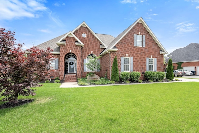 3307 Genoa Dr, Murfreesboro, TN 37128 - traditional-style house with brick siding, a front yard, roof with shingles, and entry steps