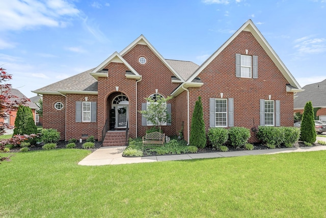 3307 Genoa Dr, Murfreesboro, TN 37128 - view of front facade with a front lawn, brick siding, and roof with shingles