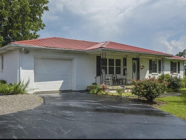 2901 Hurricane Creek Rd, Lawrenceburg, TN 38464 - ranch-style house featuring brick siding, an attached garage, covered porch, and aphalt driveway