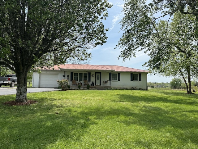 2901 Hurricane Creek Rd, Lawrenceburg, TN 38464 - single story home featuring a garage, concrete driveway, metal roof, a porch, and a front yard
