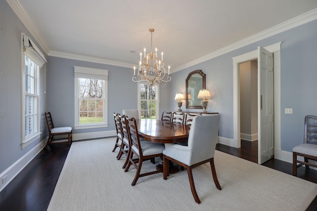 6021 Jocelyn Hollow Rd, Nashville, TN 37205 - dining space with a chandelier, dark wood-style flooring, baseboards, and crown molding