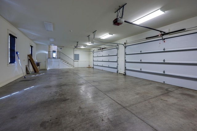 6021 Jocelyn Hollow Rd, Nashville, TN 37205 - garage with electric panel and a garage door opener