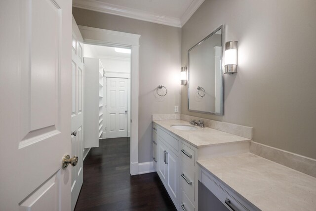 6021 Jocelyn Hollow Rd, Nashville, TN 37205 - bathroom with crown molding, wood finished floors, vanity, and baseboards