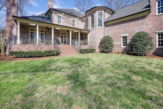 6021 Jocelyn Hollow Rd, Nashville, TN 37205 - view of front facade featuring a front yard, brick siding, ceiling fan, and covered porch