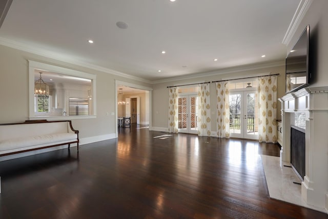 6021 Jocelyn Hollow Rd, Nashville, TN 37205 - unfurnished living room with crown molding, french doors, a chandelier, and wood finished floors