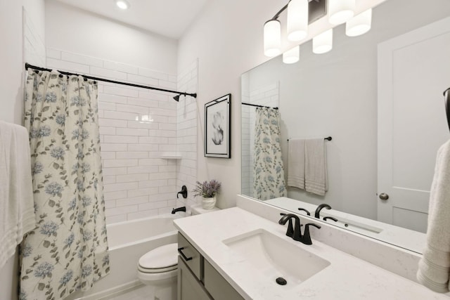 bathroom with toilet, shower / bath combo with shower curtain, and vanity