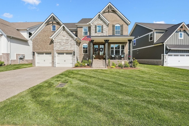 craftsman-style house featuring a front lawn, brick siding, an attached garage, driveway, and a porch