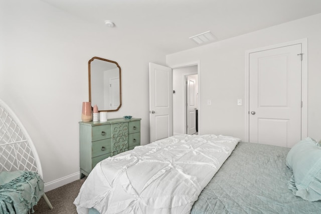carpeted bedroom with baseboards