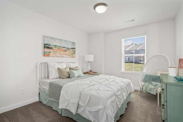 bedroom with carpet floors, baseboards, and visible vents