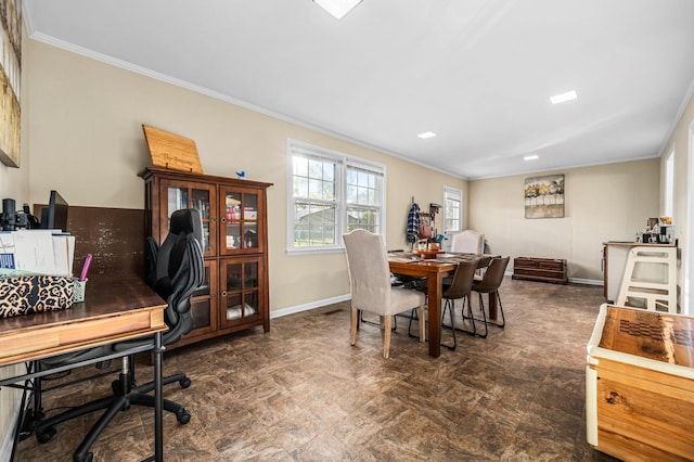 dining room featuring ornamental molding and baseboards