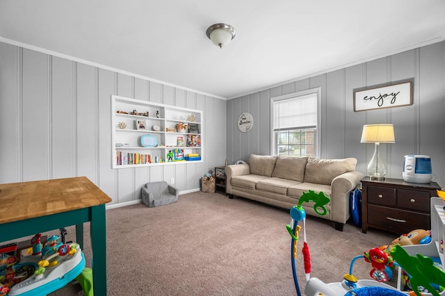 living area featuring a decorative wall, carpet, and crown molding