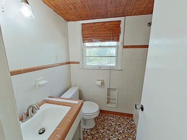 bathroom with vanity, tile walls, wooden ceiling, and toilet
