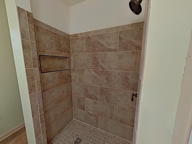 bathroom with a shower stall