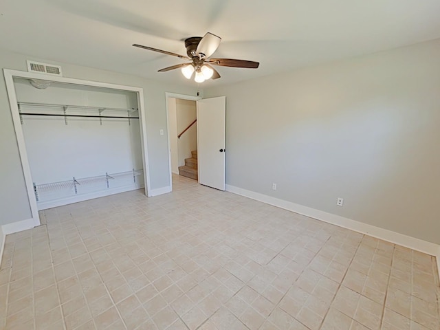 unfurnished bedroom with visible vents, baseboards, a ceiling fan, and a closet