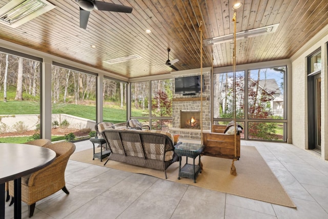 sunroom with a healthy amount of sunlight and a ceiling fan