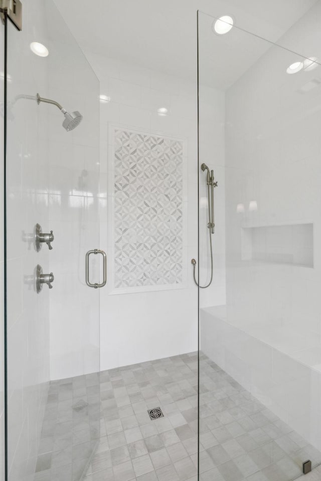 bathroom with a shower stall