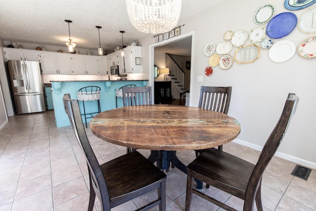 1411 Newmans Trl, Hendersonville, TN 37075 - dining room featuring a chandelier, stairway, light tile patterned floors, and baseboards