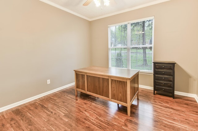 unfurnished office with ornamental molding, baseboards, a ceiling fan, and wood finished floors