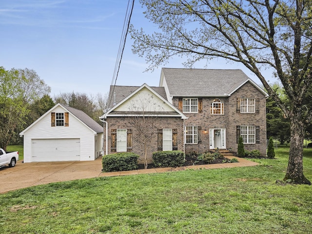 view of front of home featuring an outbuilding, a front lawn, and brick siding