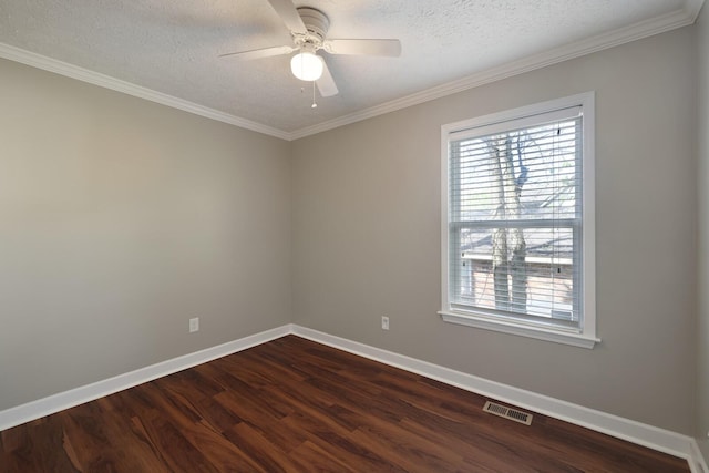 empty room featuring dark wood-style flooring, baseboards, a ceiling fan, and visible vents