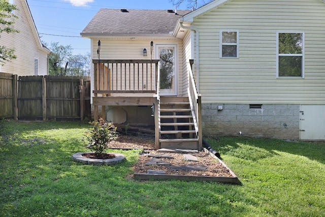 back of house with crawl space, a yard, a fenced backyard, stairway, and a shingled roof