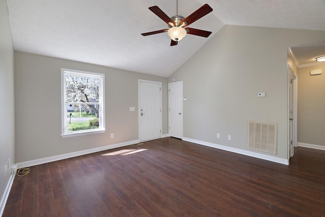 unfurnished room with visible vents, baseboards, a ceiling fan, dark wood finished floors, and vaulted ceiling