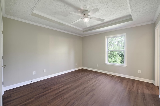unfurnished room with a tray ceiling, baseboards, a ceiling fan, and dark wood-style floors