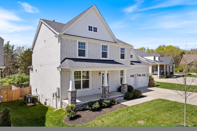 900 Easton Dr, Mount Juliet, TN 37122 - view of front of house with covered porch, fence, brick siding, a front lawn, and driveway
