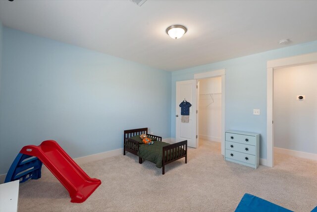 900 Easton Dr, Mount Juliet, TN 37122 - carpeted bedroom featuring a closet, a walk in closet, and baseboards