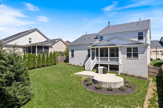900 Easton Dr, Mount Juliet, TN 37122 - rear view of property with a sunroom, a yard, a patio area, fence, and brick siding