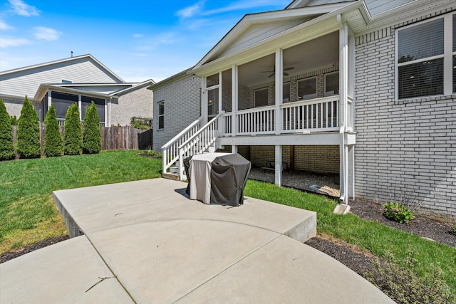 900 Easton Dr, Mount Juliet, TN 37122 - exterior space with a sunroom, a yard, a patio area, stairs, and brick siding