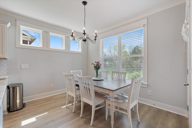 900 Easton Dr, Mount Juliet, TN 37122 - dining area featuring a chandelier, light wood-type flooring, and baseboards