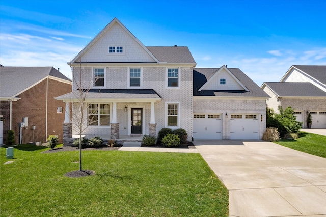 900 Easton Dr, Mount Juliet, TN 37122 - view of front of property with covered porch, a front lawn, brick siding, an attached garage, and driveway