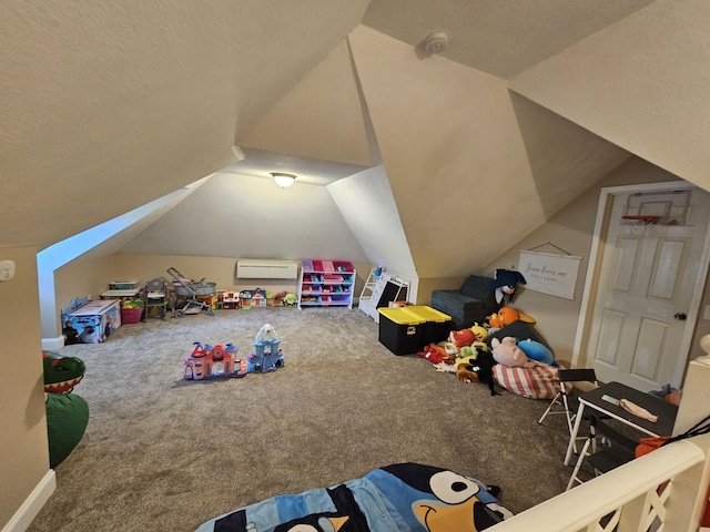 recreation room featuring vaulted ceiling, carpet floors, a textured ceiling, and an AC wall unit