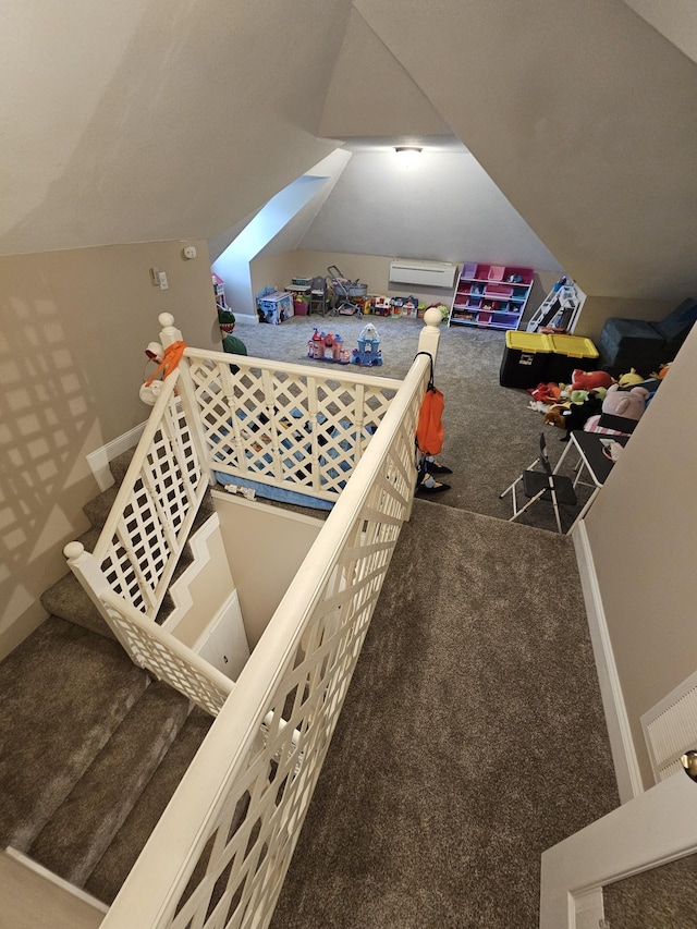 bedroom with carpet flooring and an AC wall unit