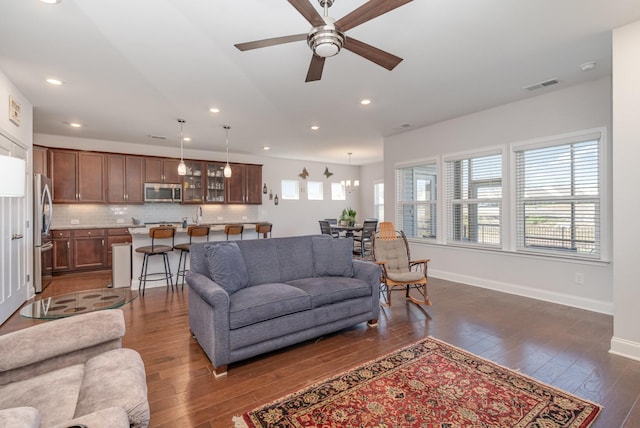 359 Mattieton Ln, Gallatin, TN 37066 - living area with baseboards, visible vents, dark wood-style flooring, and a ceiling fan