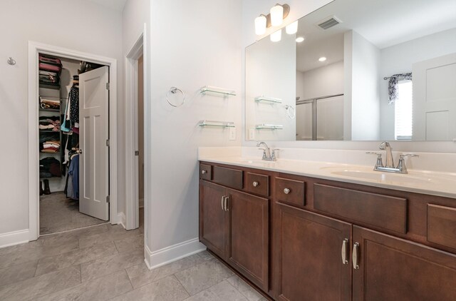 359 Mattieton Ln, Gallatin, TN 37066 - full bathroom featuring a sink, visible vents, a shower stall, and double vanity