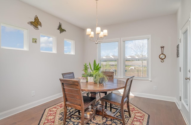 359 Mattieton Ln, Gallatin, TN 37066 - dining room featuring wood finished floors, a notable chandelier, and baseboards