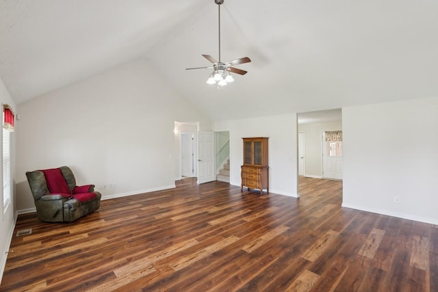 interior space featuring visible vents, ceiling fan, stairway, and wood finished floors
