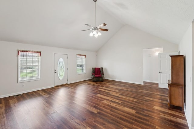 entryway with high vaulted ceiling, dark wood-type flooring, a ceiling fan, visible vents, and baseboards
