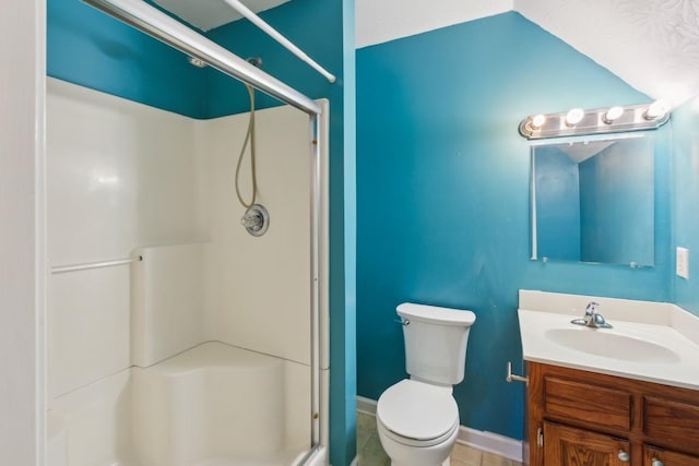 full bathroom featuring a shower stall, vanity, toilet, tile patterned floors, and baseboards