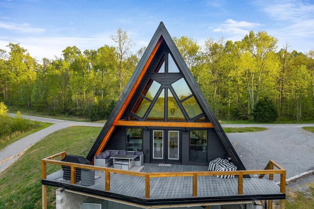 825 Hunters Landing Ln, Smithville, TN 37166 - exterior space featuring a wooden deck, a view of trees, a yard, and french doors